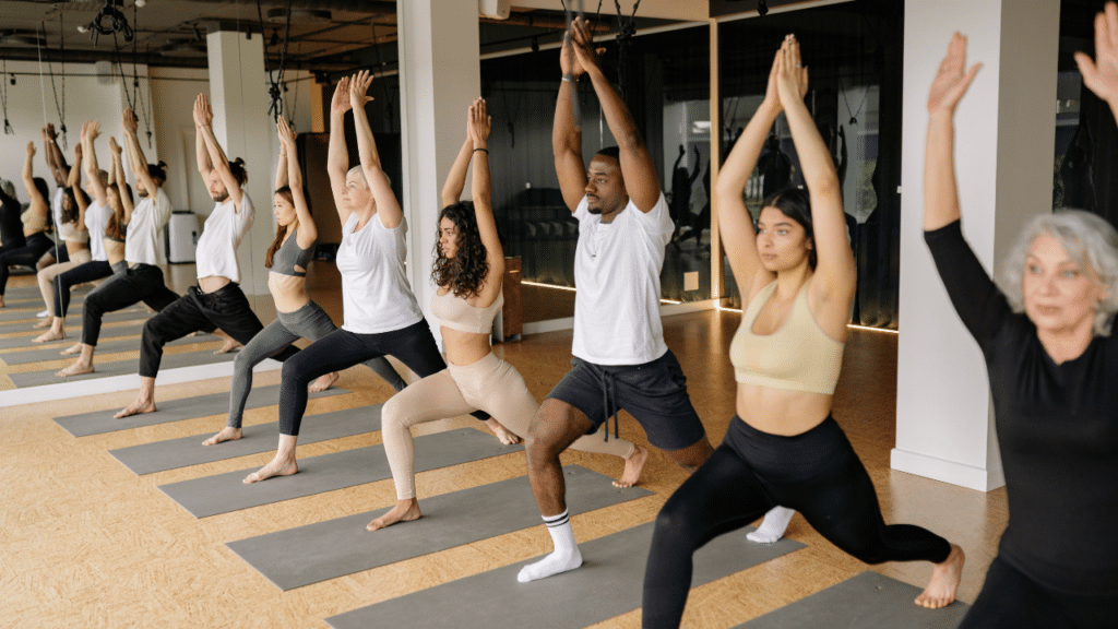 A group of all ages doing yoga for Yoga's Benefits and Risks