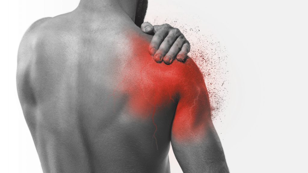 Black and white photo of a man holding his bare shoulder that is highlighted in red to show shoulder pain