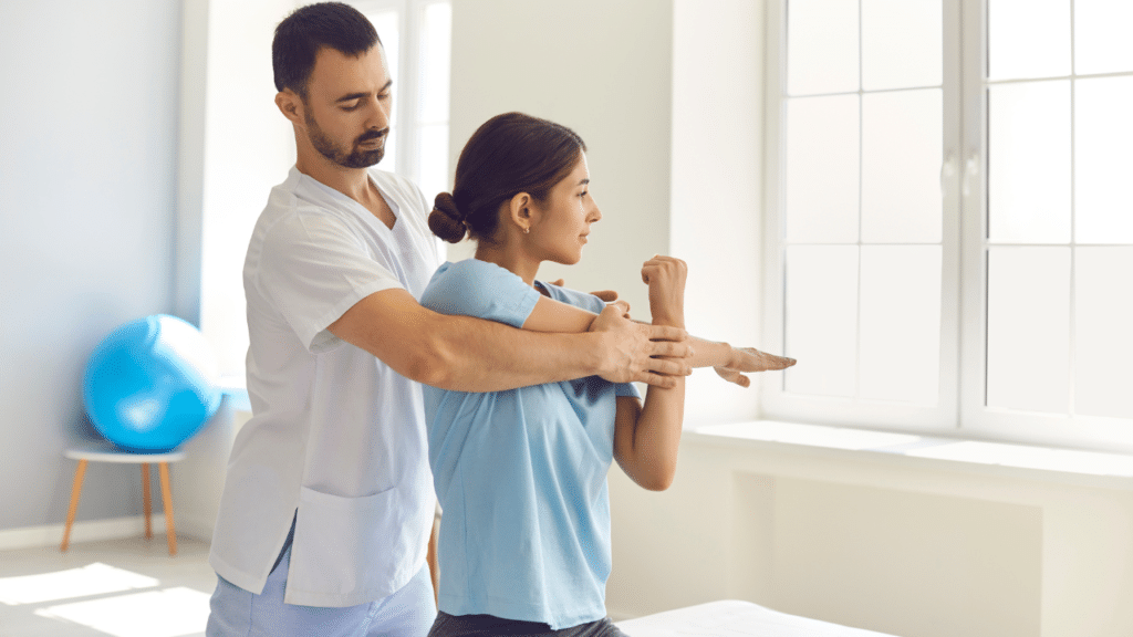 Physical therapist helps patient in Austin to stretch out shoulder