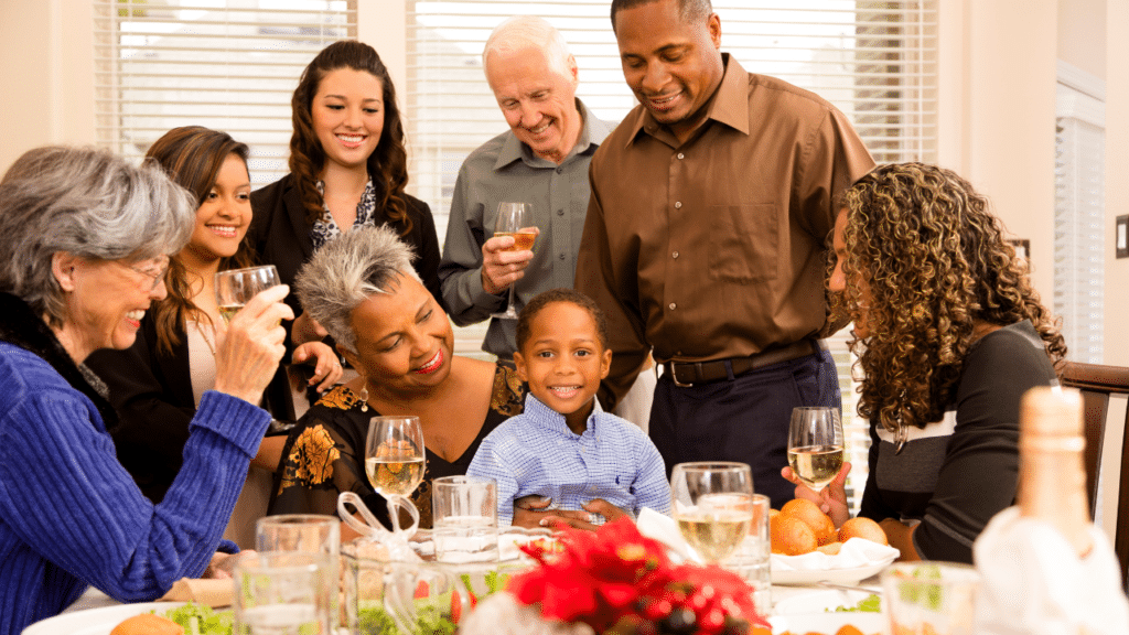 family around the table enjoying a meal together after Finding Relief From Nerve Pain This Holiday Season