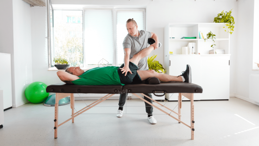 Austin physical therapist uses Manual Physical Therapy’s Benefits for Hip Bursitis Pain on patient laying on table