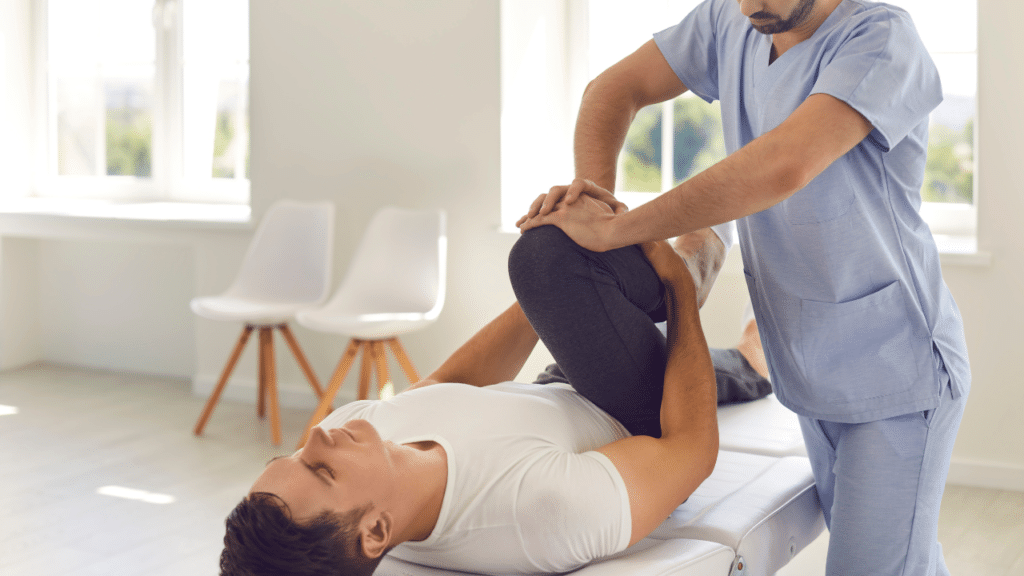 Manual Physical Therapy’s Benefits for Hip Bursitis Pain used by physical therapist who is applying pressure to patient's knee as they stretch
