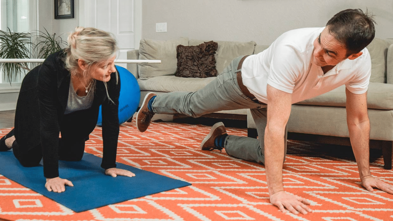 Founder of Move Empower Concierge Physical Therapy Eric Finger works with a patient in their home to show them How Concierge Physical Therapy Brings Therapeutic Exercise to You