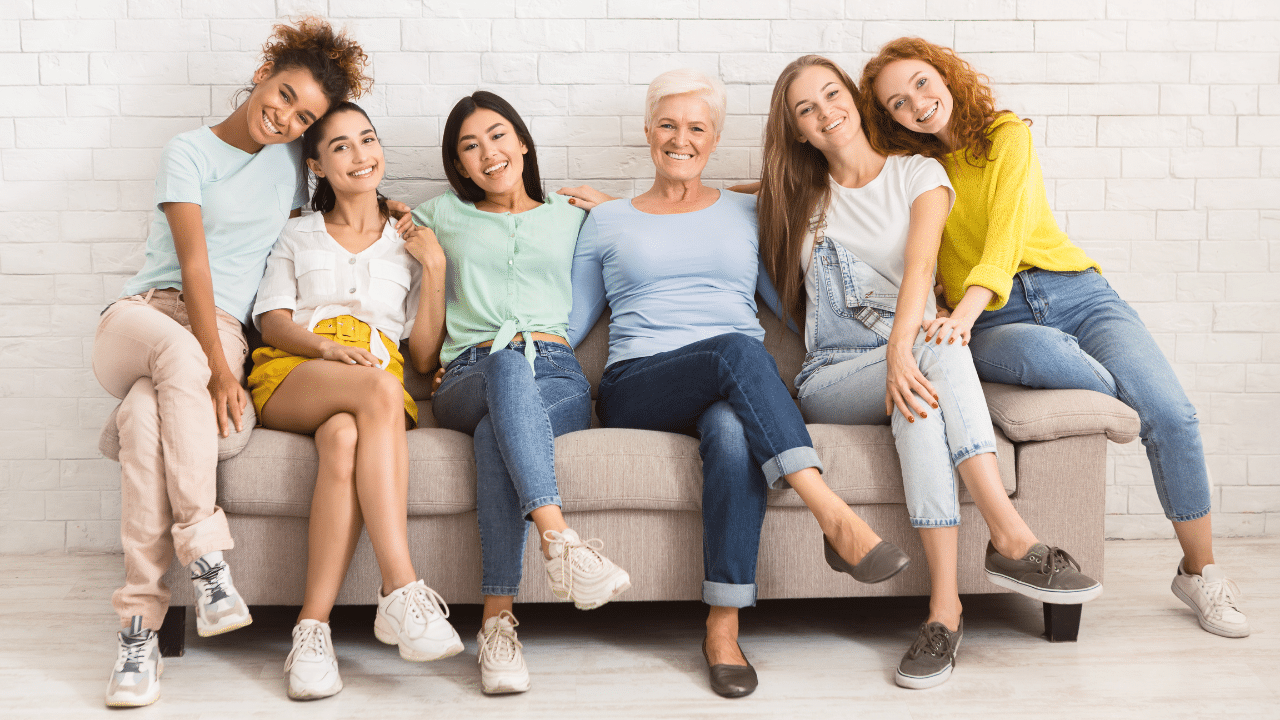 Women sit together on a couch as they learn Why Women Are More Prone to Hip Pain