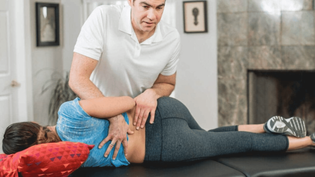 Eric Finger works with a patient to show her How Concierge Physical Therapy Brings Therapeutic Exercise to You in Austin
