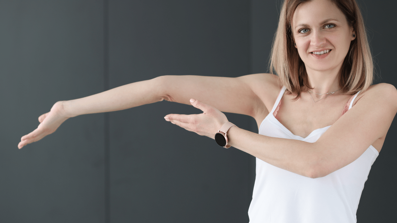Woman overextending arm to show hypermobility