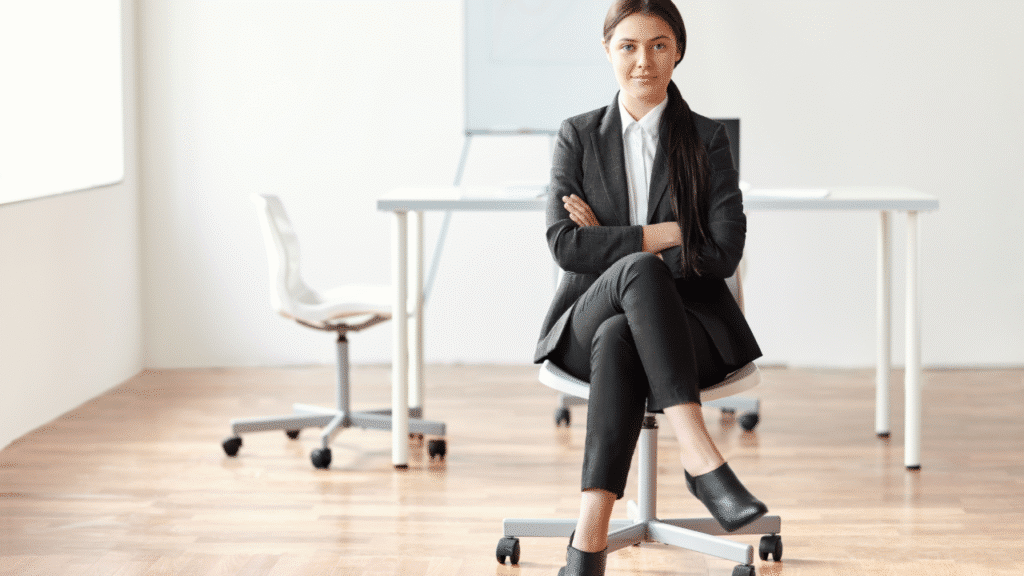 A woman from Austin Texas sitting in a chair wondering Why Lateral Hip Pain Shows Up Differently in Women