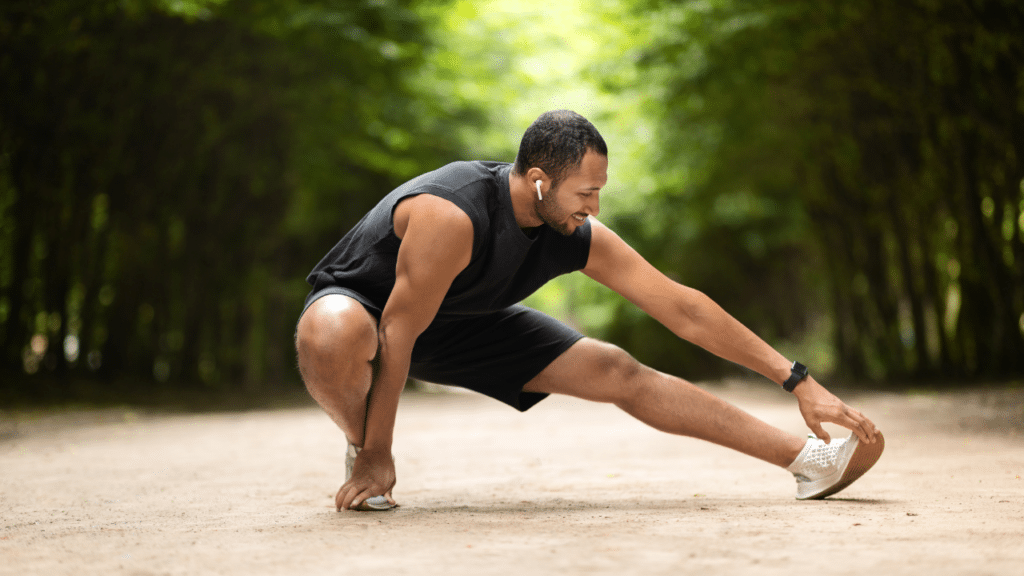 Man stretches hamstrings, trying to figure out Why Your Hamstrings Are Tight