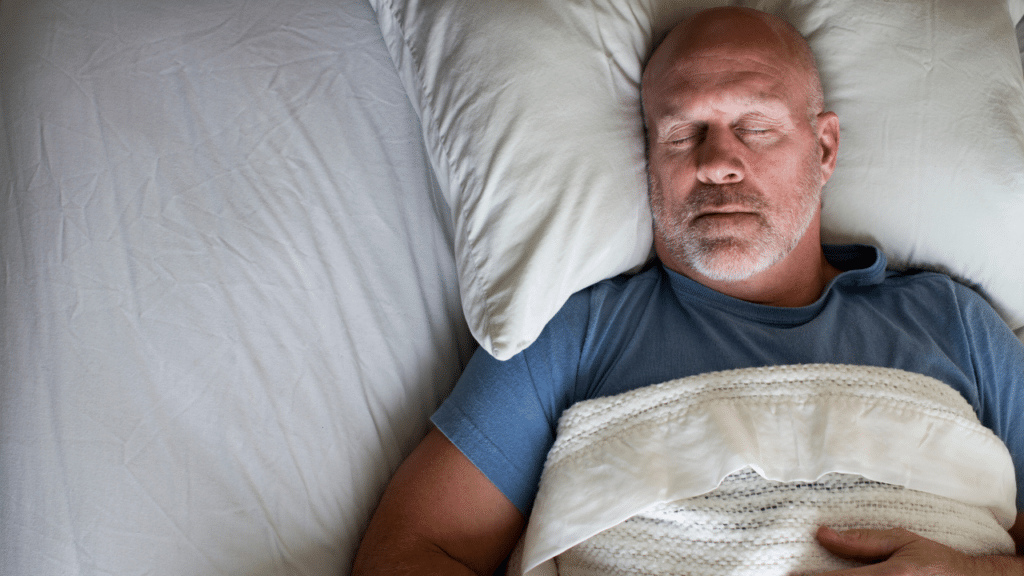 Man sleeping on back, wondering How Your Sleeping Position Affects Your Body