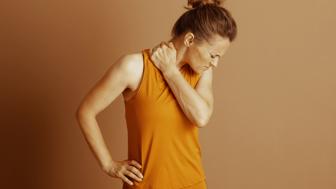 Woman holds shoulder in pain wondering When Shoulder Pain Means Bicipital Tendonitis