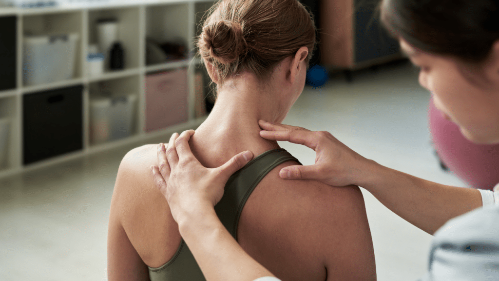 PT examines woman for info on Non-Operative Treatment for Frozen Shoulder