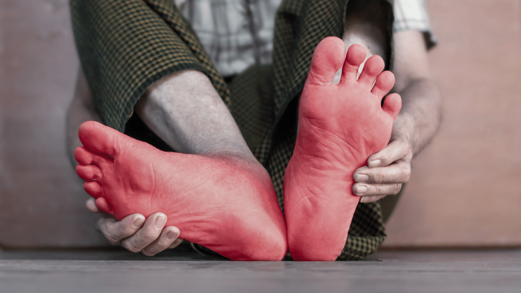 Person holds feet in pain with Neuropathy FAQs for an Austin, TX physical therapist