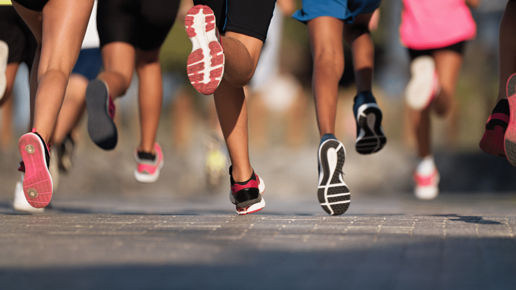 Runners in a marathon wondering about Ankle Mobility Exercises You Need Before Running This Summer