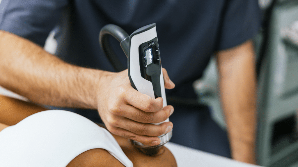 PT uses shockwave therapy in Austin, TX on a patient