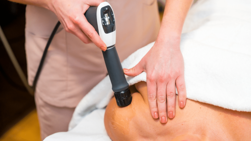 Austin, TX physical therapist uses shockwave treatment on patient's shoulder