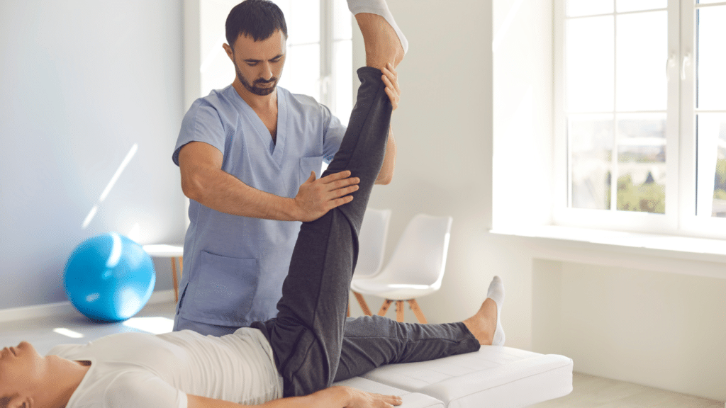 In-home physical therapist in Wooten, TX work's on a patient's leg