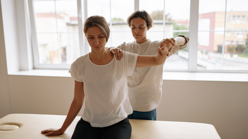Physical therapist works on a patient's shoulder in Allandale, TX as part of in-home physical therapy