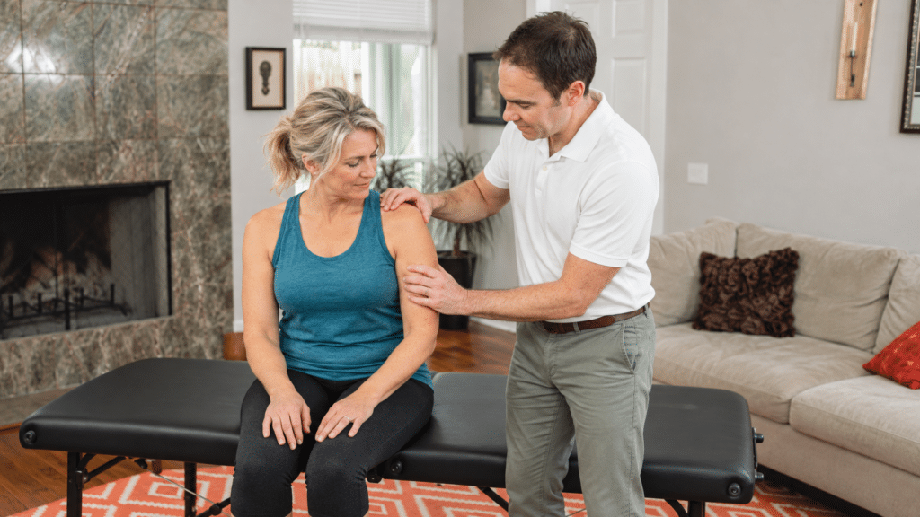 Physical therapist Eric Finger helps a patient with Shoulder Pain Physical Therapy in Austin, TX