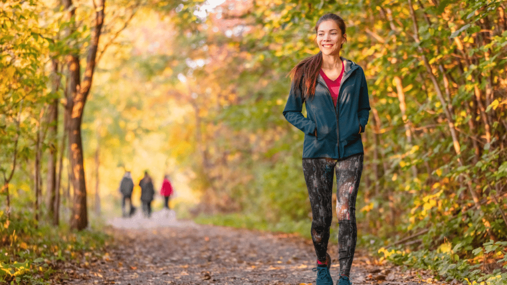 woman walks on a trail before contacting a northwest hills tx physical therapist